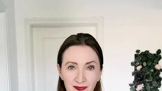 Busty milf in red stockings with a belt plays with her pussy