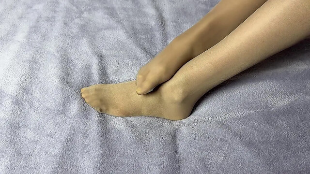 Hot MILF secretary caresses her nylon-clad legs