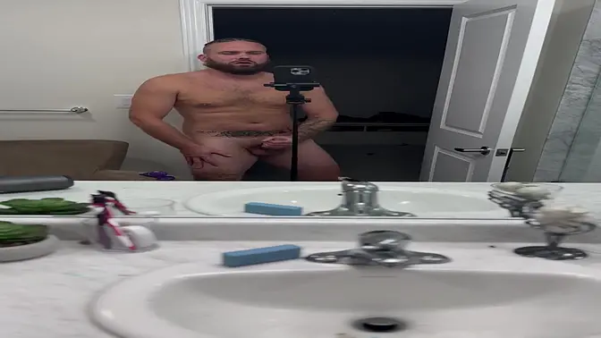 Amateur cum slut jacks off in mirror and cums all over