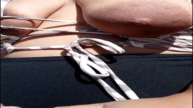 Amateur wife with a thick and curvy body flashes her big tits at the