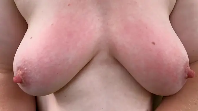 Babe's big tits turned red from tit slapping near a tree