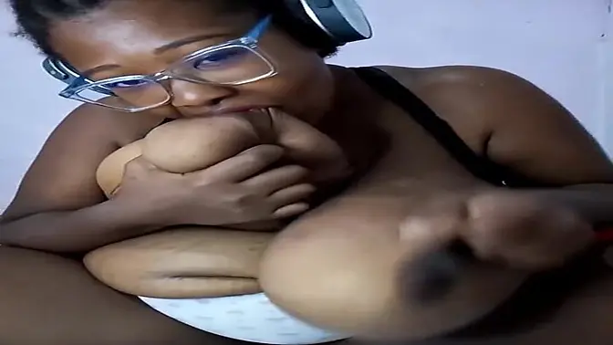 Big-titted ebony milf sucks her huge melons