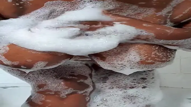 Black MILF with big boobs teases in bath