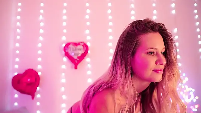 Blonde babe in romantic lingerie teases her big natural tits