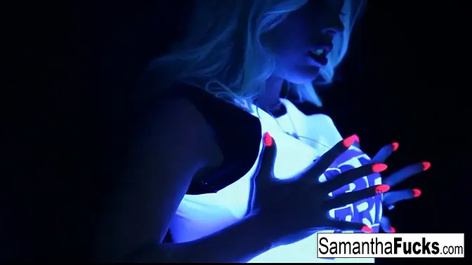 Blonde babe Samantha Saint masturbates in a hot black light