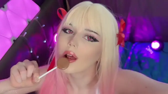Blonde cosplay girl licks lollipop for ASMR relaxation