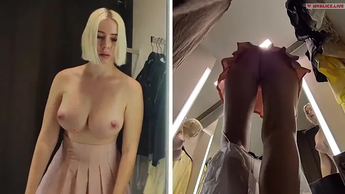 Blonde gets her juicy pussy exposed in public fitting room