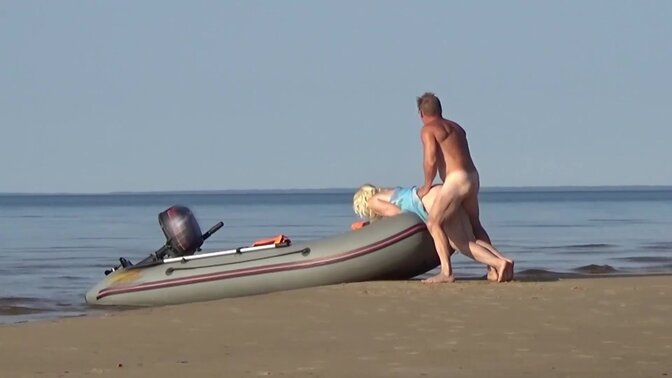 Blonde MILF gives a blowjob and shows off her round ass at the beach