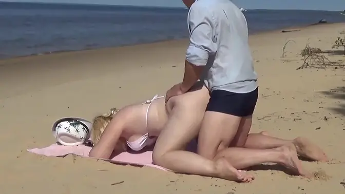 Blonde MILF sucks and rides cock on the beach