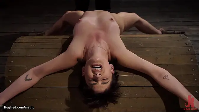 Bound to wooden pony in squat position brunette slave Kristen Scott hairy pussy vibed then in back arch position whipped till suspended fingered by master The Pope