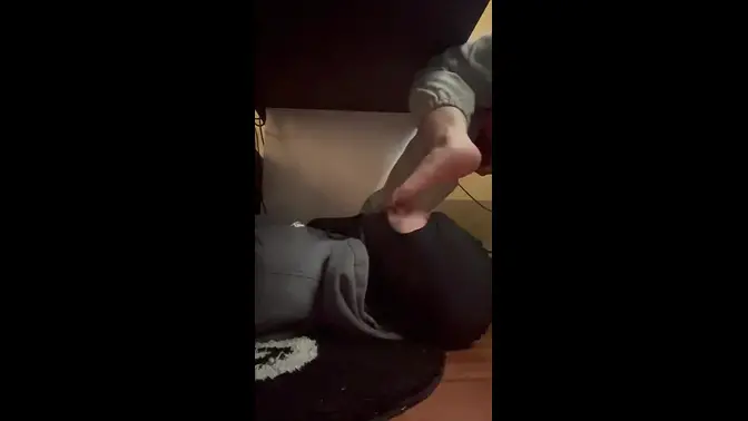 Bratty sis humiliates foot slave under desk