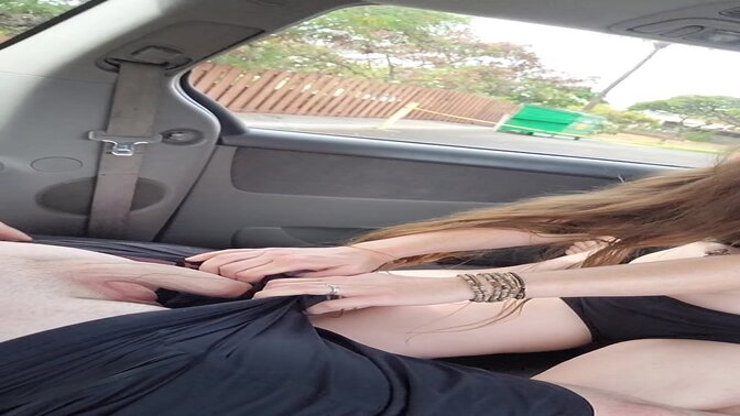 Brunette MILF sucks and strokes his big cock in public