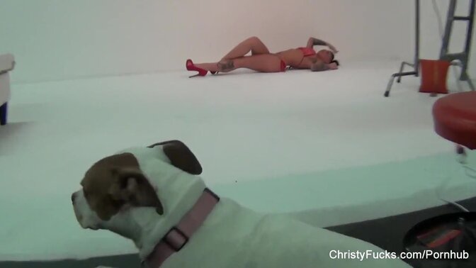 Busty blonde Christy Mack gets a lesbian lesson on set