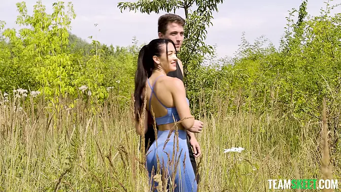 Busty brunette babe massages lucky guy's cock through yoga pants