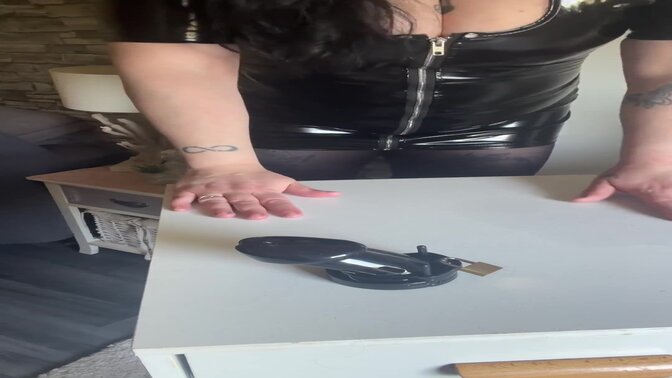 Busty latex mistress dominates and teases her submissive slave