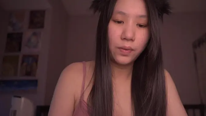Chinese cosplay fox girl reads to herself in ASMR