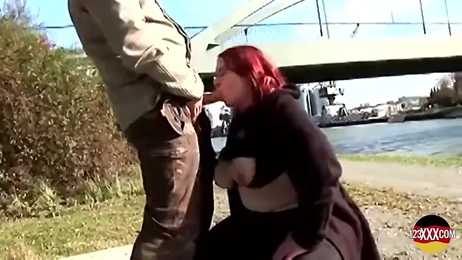 Chubby redheaded babe rides hard cock outdoors