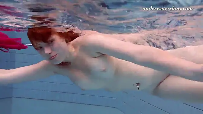 Chubby teen Lenka shows off her big boobs in a bikini