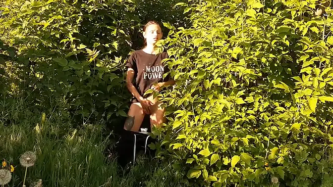 Curvy girl jacks off in nature, gets caught by a guy