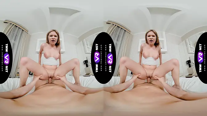 Curvy model stripped and posed in a cage