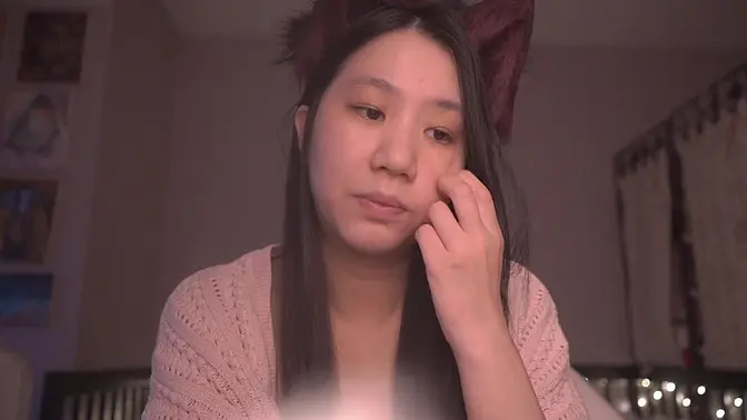 Cute Chinese girl reads aloud in Kitty Cat cosplay