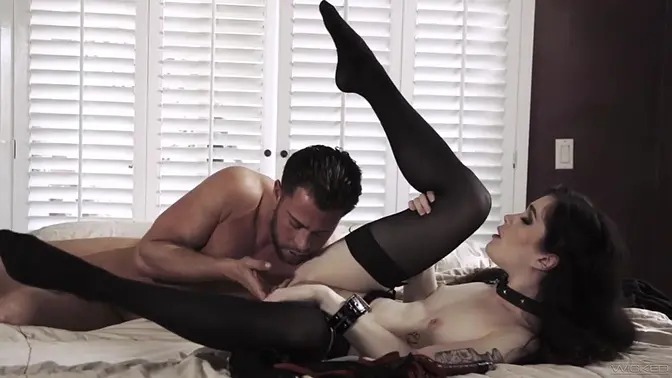 Evelyn Claire plays submissive in a collared and cuffed scene