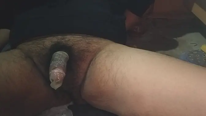 Fat guy jacks off with a condom