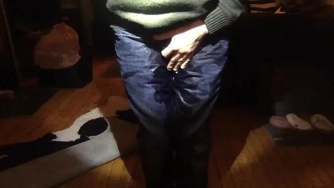 Feeling the warmth of piss spreading in wet jeans