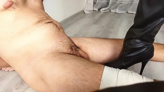 Femdom: Dominatrix Nika tramples big cock with her boots