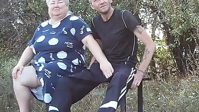 Friend gives milf a handjob on a public park bench