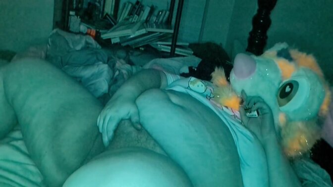 Fur-clad GF plays with a dildo while jacking it off