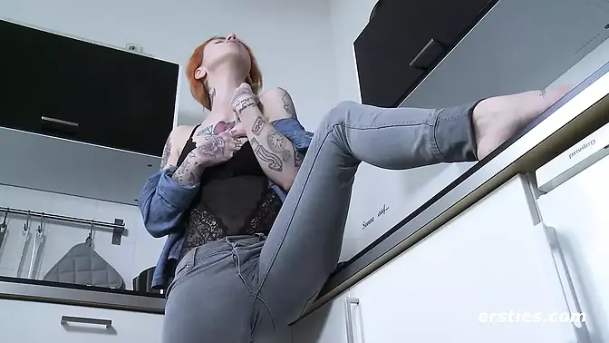 German redhead Frieda rides dildo in the kitchen