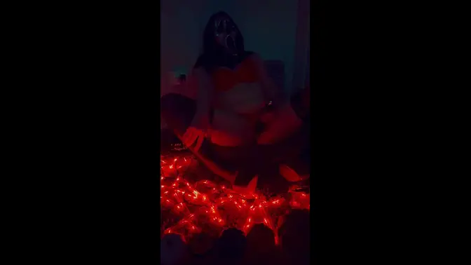 Goth girl in Halloween costume rubs clit and foot