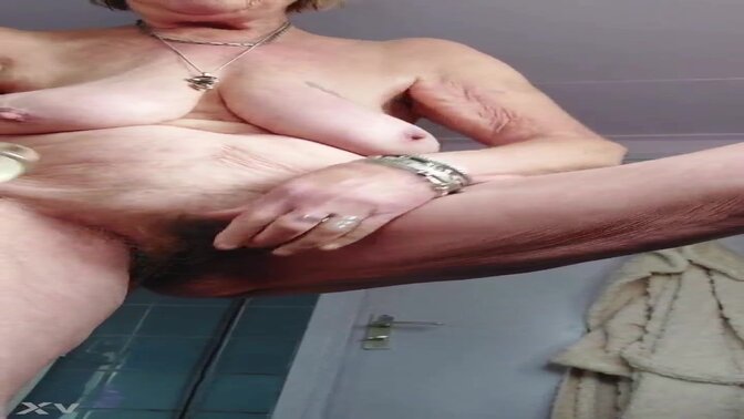 Hairy granny gets her pussy fucked by a dildo