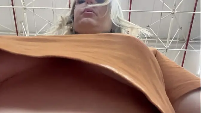 Hidden cam captures busty blonde's public masturbation