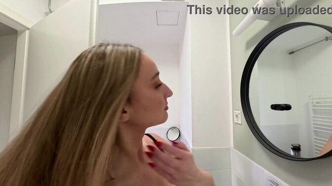 Hot college girl shows off her big-assed mini-skirt in the bathroom