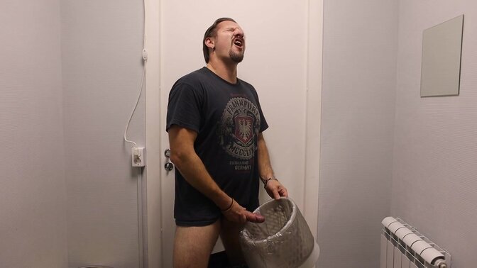 Hot daddy suddenly jacks it in an office, aiming his cumshot into a rubbish bin 