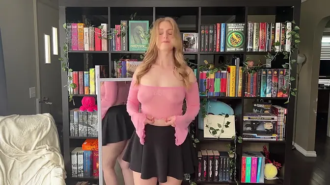 Hot female in pink transparent top tries on haul and teases with her body