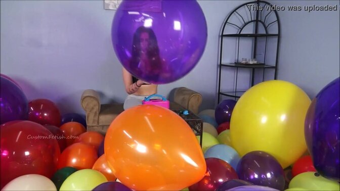Hot looners pop and play with balloons at a party