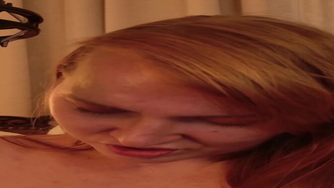 Hot redhead gives a horny webcam performance