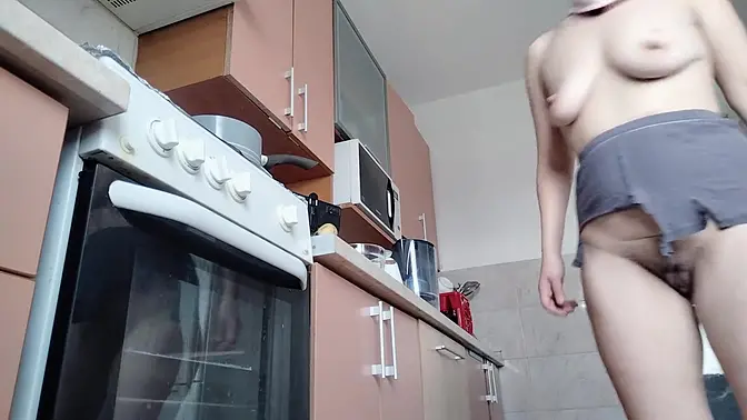 Hot wife dances naked in kitchen, showing off her big ass and tits