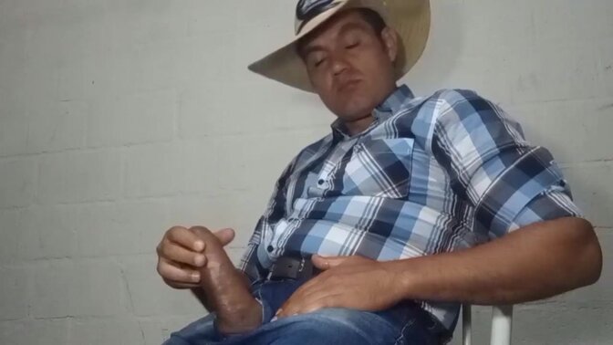 Hunky cowboy takes his big dick in hand for a hot solo session