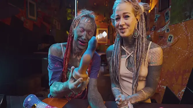 Inked couple plays with big dildo during toy unboxing