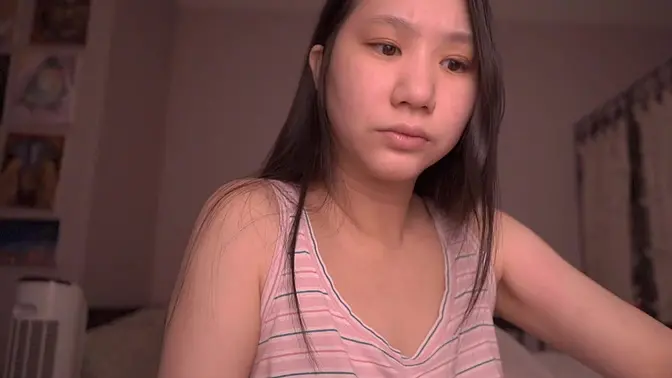 Innocent Chinese girl reads book softly while getting fucked