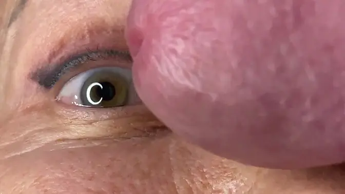 Mature MILF face-fucked by a huge, uncut cock