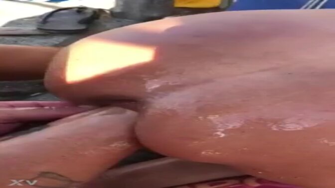 Milf gets double-fisted at the beach