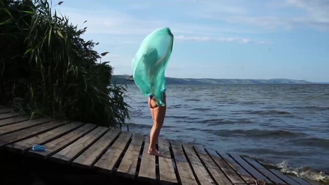 MILF in a Bikini Showcases Her Sexy Dance Moves on Windy Beach