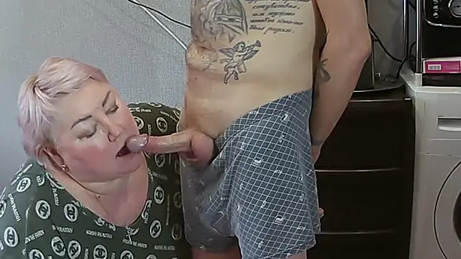 MILF mother-in-law deepthroats and jerks off her stepson's cock