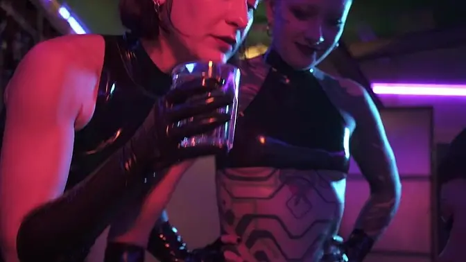 Mistress Ae dominates with strap-on in latex, Eva Elfie assists