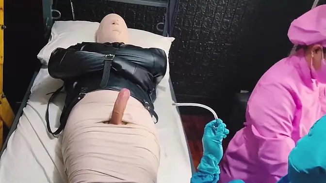 Mistress dominates mummified patient with medical sounding